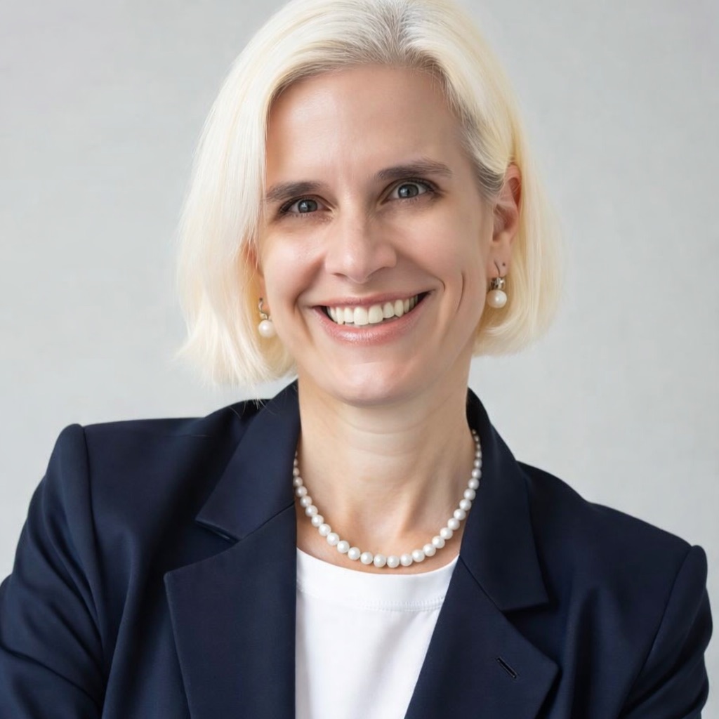 Dr. Helen Mabry, breast surgical oncologist, smiling in a navy blazer